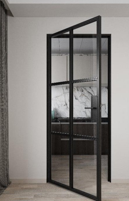 Modern interior door with black frame and glass panels in a minimalistic room.